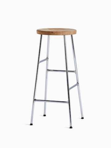 A front angle view of the Cornet Barstool with oak seat and chrome leg base. Select to go to the Cornet Stool product page.