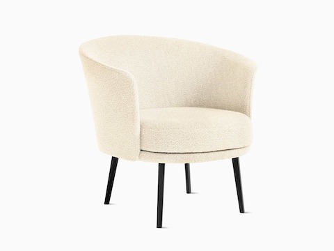 A front angle view of a Dorso Lounge Chair in cream with black dowel legs.