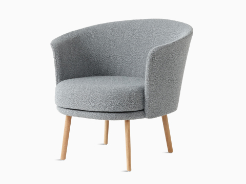 A front angle view of the Dorso Lounge Chair with grey seat and back, and oak legs.