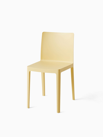 A three quarter angle view of a yellow Élémentaire Side Chair.