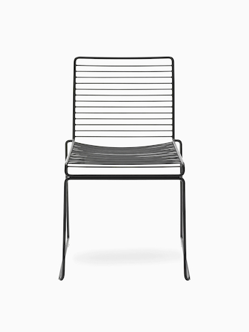 A front view of the Hee Dining Chair in black. Select to go to the Hee Chair product page.