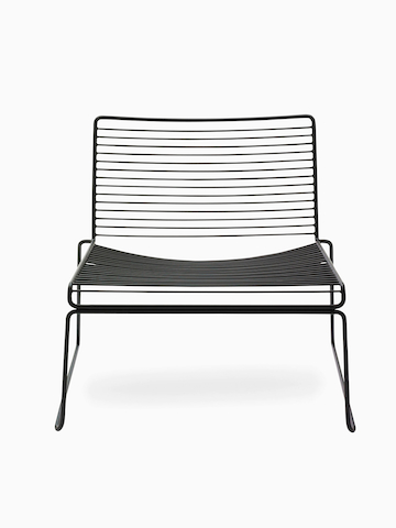 A front view of the Hee Lounge Chair in black. Select to go to the Hee Lounge Chair product page.