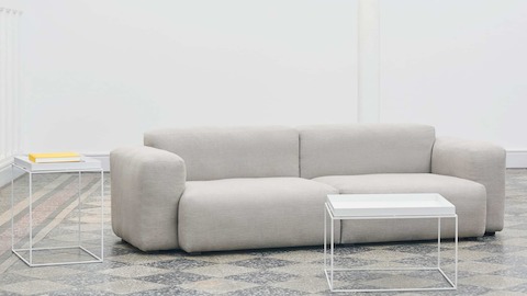White Tray Coffee Table and Tray Side Table staged with a grey Mags Soft Sectional Sofa.