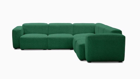 A front view of the Mags Soft Low Sectional in green.