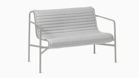 A three quarter view of a Palissade Dining Bench Quilted Cushion in light grey.