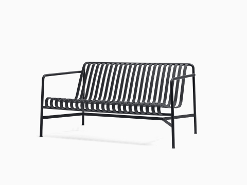 A three quarter view of a Palissade Lounge Sofa in dark grey. A three quarter view of a Palissade Lounge Sofa in dark grey.