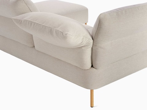 A back angled detail view of the Pandarine Sectional in beige.