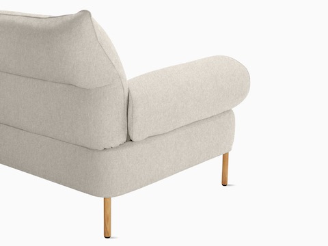 A back angled detail view of the Pandarine Sofa in beige.