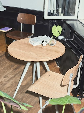 Pyramid Café Table with Oak top and beige frame next to two Result Chairs.