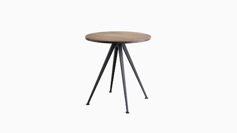 A front view of the Pyramid Café Table-round with Smoked Oak top and black frame.