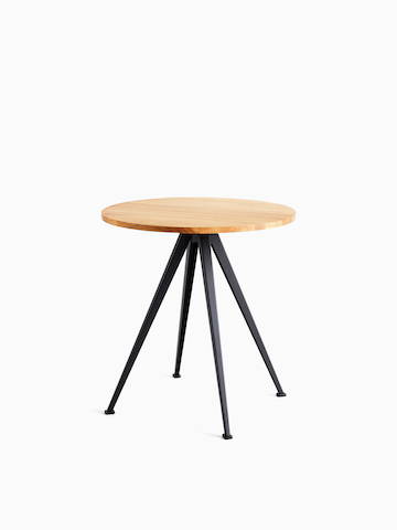 A front view of the Pyramid Café Table-round with Oak top and black frame. Select to go to the Pyramid Café Table product page.