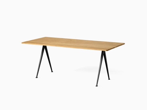 A front angle view of the Pyramid Table with overhang in Oak top and Black frame.