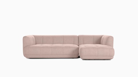 A front view of a light pink Quilton Sectional - Right Chaise.
