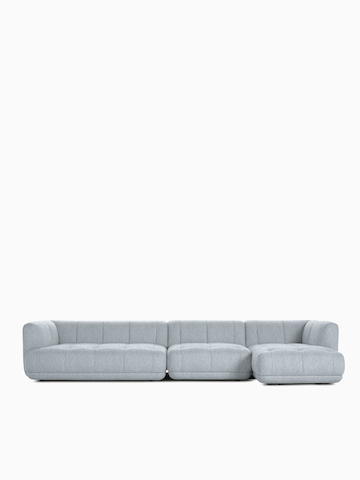 A front view of a gray 3-piece Quilton Sectional - Right Chaise.