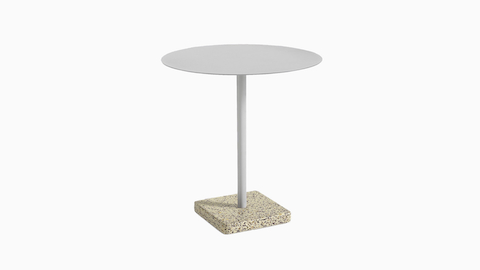 A round Terrazzo Table in light grey with a grey Terrazzo base.