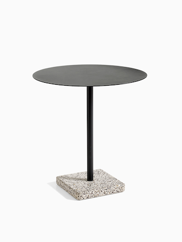 A round Terrazzo Table in black with a grey Terrazzo base. Select to go to the Terazzo Table product page.