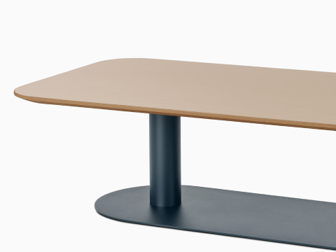 A seated-height Headway Cafe Table with a soft-rectangular top, Clear on Ash finish, and Nightfall base.