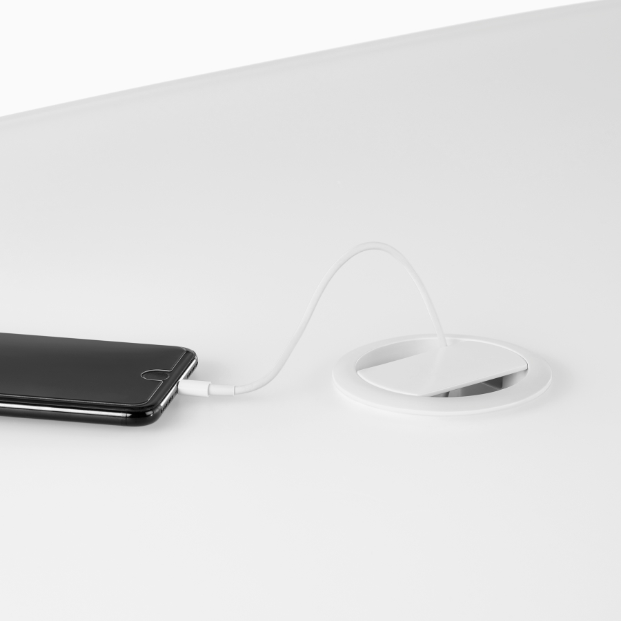 Round electrical access embedded in the surface.