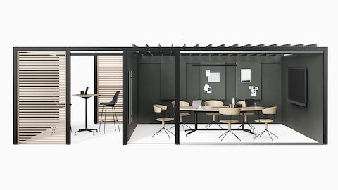 Dos espacios Overlay adyacentes con una mesa de conferencias Headway con base en Y en uno y mesas de pie Eames en el otro.