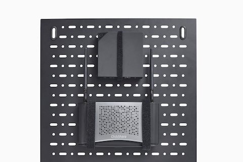 Primer plano del panel de montaje tecnológico desmontable de la mesa de conferencias Headway con un componente tecnológico Clickshare adjunto.