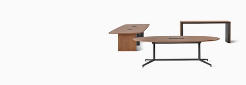 A group of three Headway conference tables, one with a Y base, one with a cabinet base, and one communal table. 