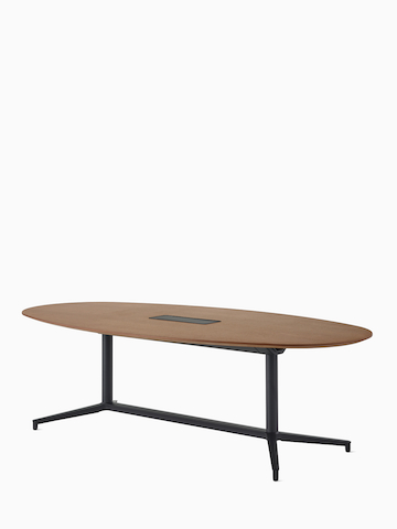An oval Y-base Headway Conference Table with a medium wood top and black base viewed at a 45-degree angle.