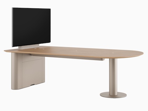 A D-shaped Headway Huddle Table with a light wood top, Metallic Champagne base, and monitor mount.