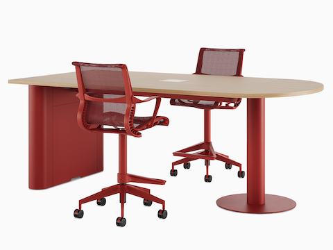 A Headway Huddle Table with a light wood top, Canyon base, Logic power cut-out, and Setu Stool.