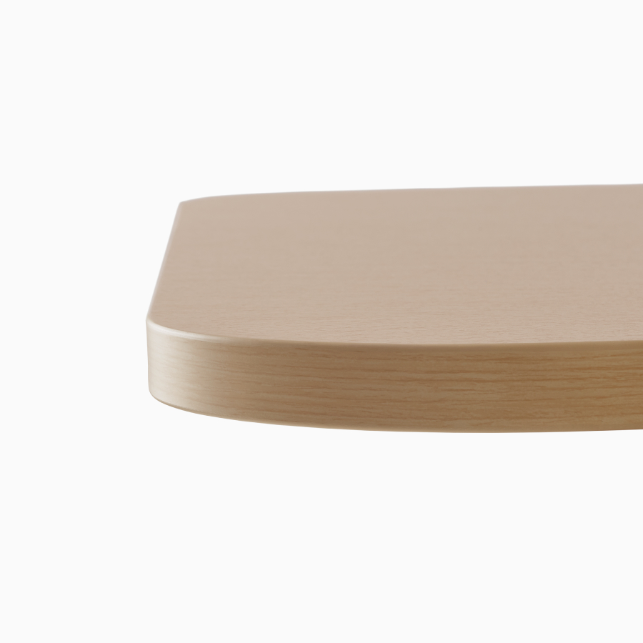 Close view of the square edge on a Headway table with a Clear on Ash finish.