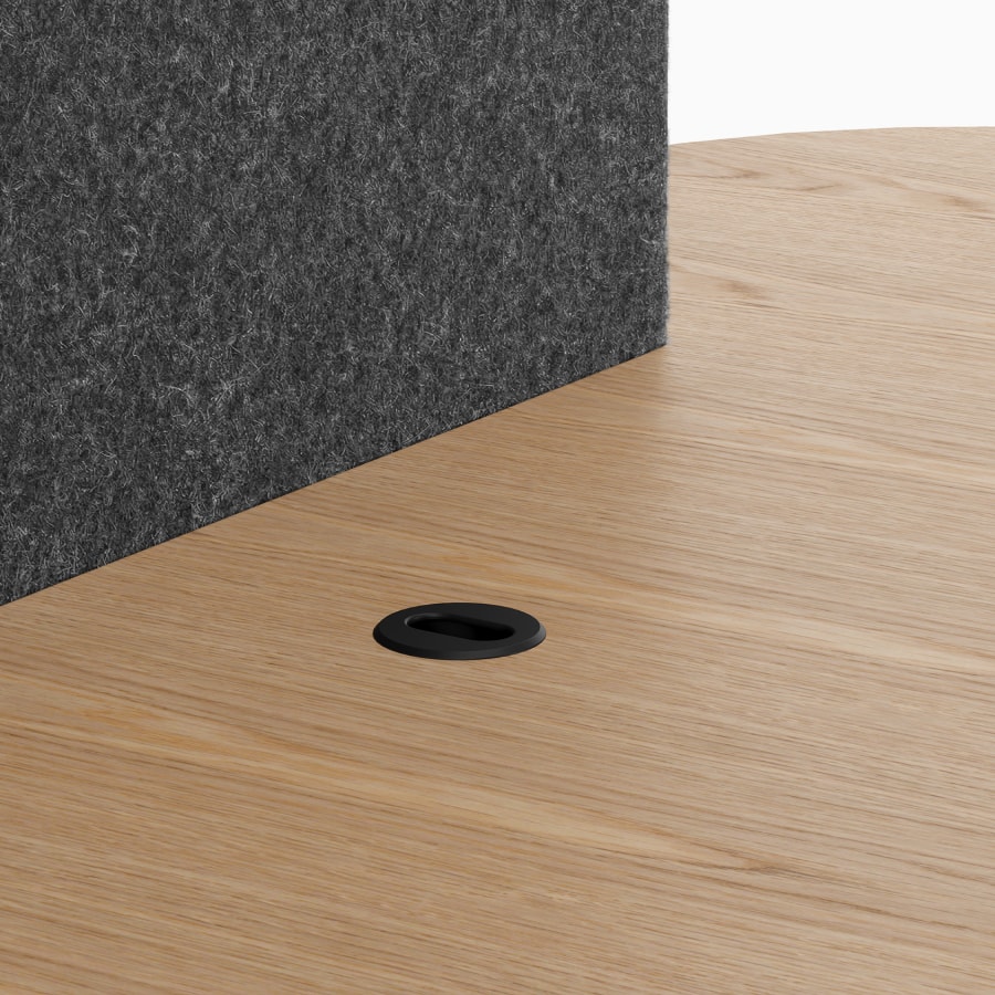 A Headway Huddle Table with an embedded media access grommet.