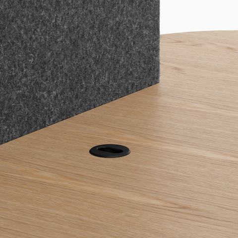 A Headway Huddle Table with an embedded media access grommet.