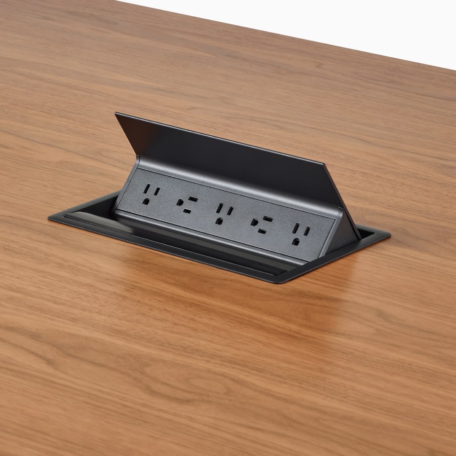 Close view of a Headway table with Logic 5-outlet power access.