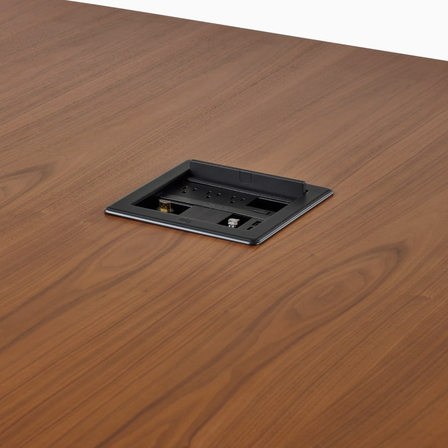 Close view of a Headway table with a Crestron unit installed.