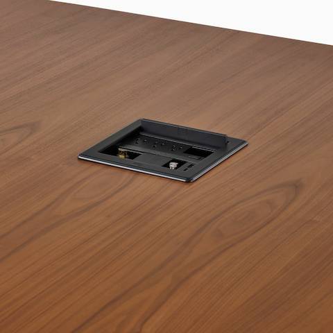 Close view of a Headway table with a Crestron unit installed.