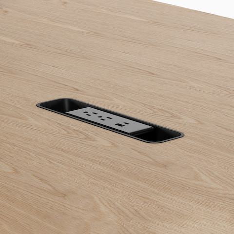 A Headway table with Cove Collection drop-in power.