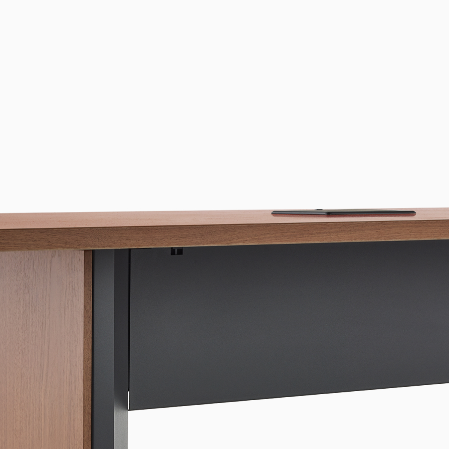 Close view of a Headway table with a black metal tech curtain.