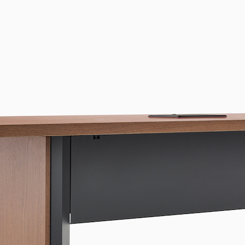 Close view of a Headway table with a black metal tech curtain.