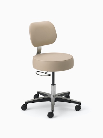 Lab Stool in a beige upholstered seat and back and a chrome base with D-ring adjustment, and a 5-star base with casters.