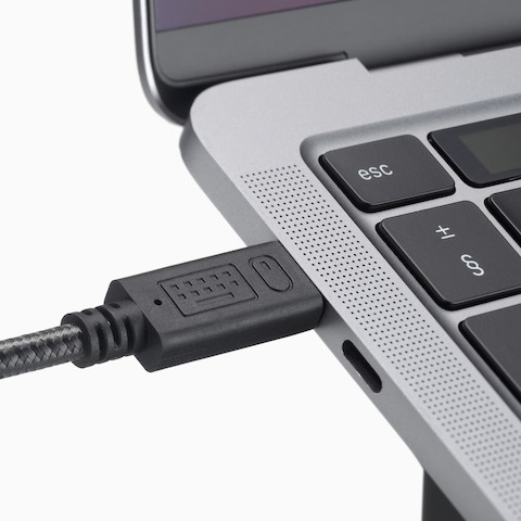 A close-up view of the cable on a Lana Laptop Stand.