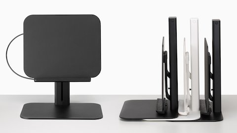 从正面看黑色的 Lana 笔记本电脑支架，从侧面看一堆黑色和白色的 Lana 笔记本电脑支架。