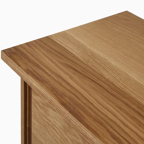 A detail view of the Land Storage top in oak.