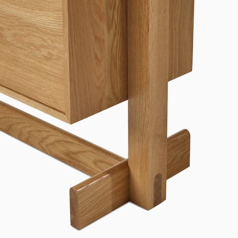 A detail view of the Land Storage leg in oak.