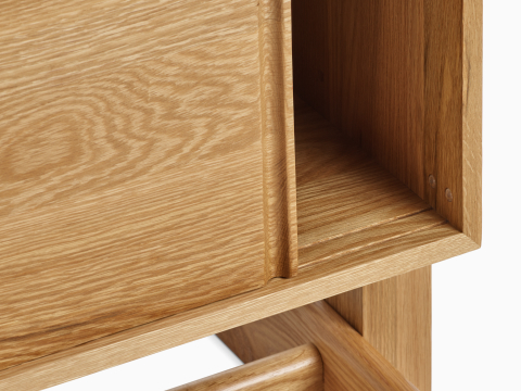 A detail view of the Land Storage top in oak.