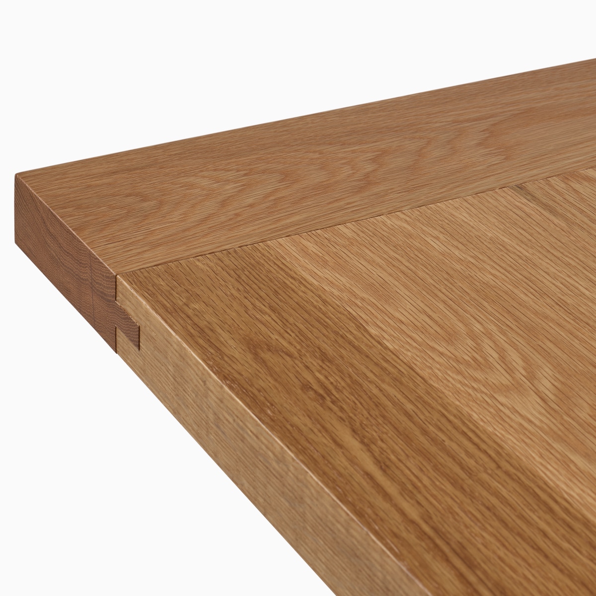 A detail view of the Land Table top in oak.