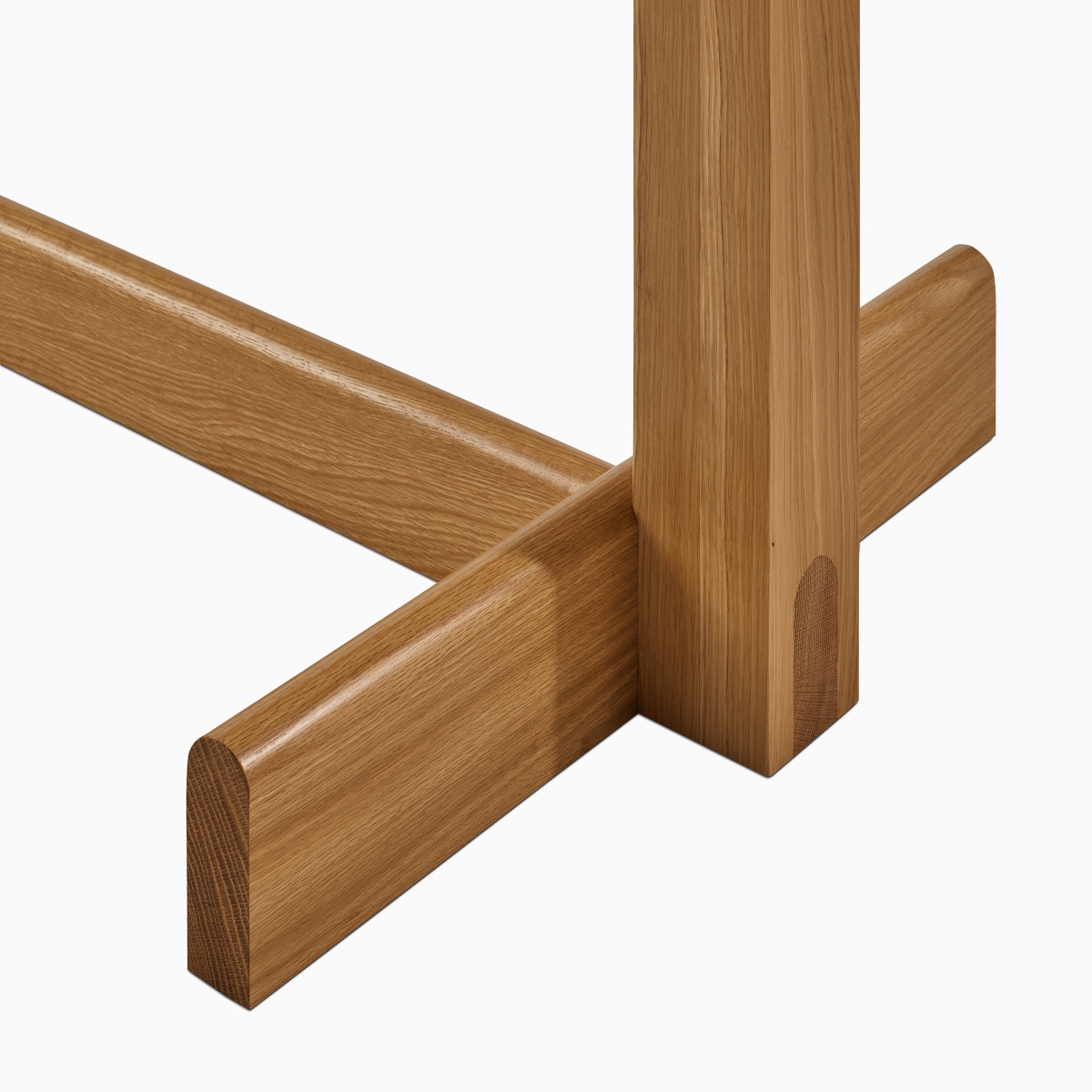 A detail view of the Land Table leg in oak.