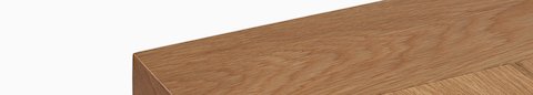 A detail view of the Land Table top in oak.