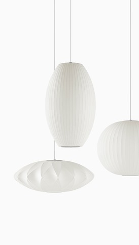 Hanging Nelson Bubble Lamps of three different shapes. Select to go to the Herman Miller accessories landing page.