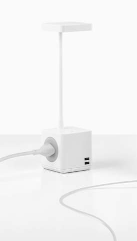A Cubert Personal Light with integrated AC power and USB ports. Select to go to the Herman Miller accessories landing page. 