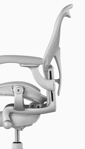 Profile view of a light gray Aeron office chair. Select to go to the Thrive Ergonomic Portfolio landing page. 