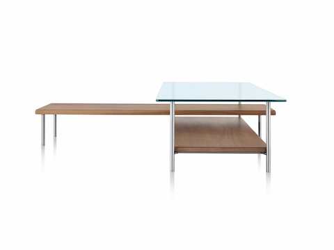 An L-shaped Layer glass top coffee table with two wood lower shelves.